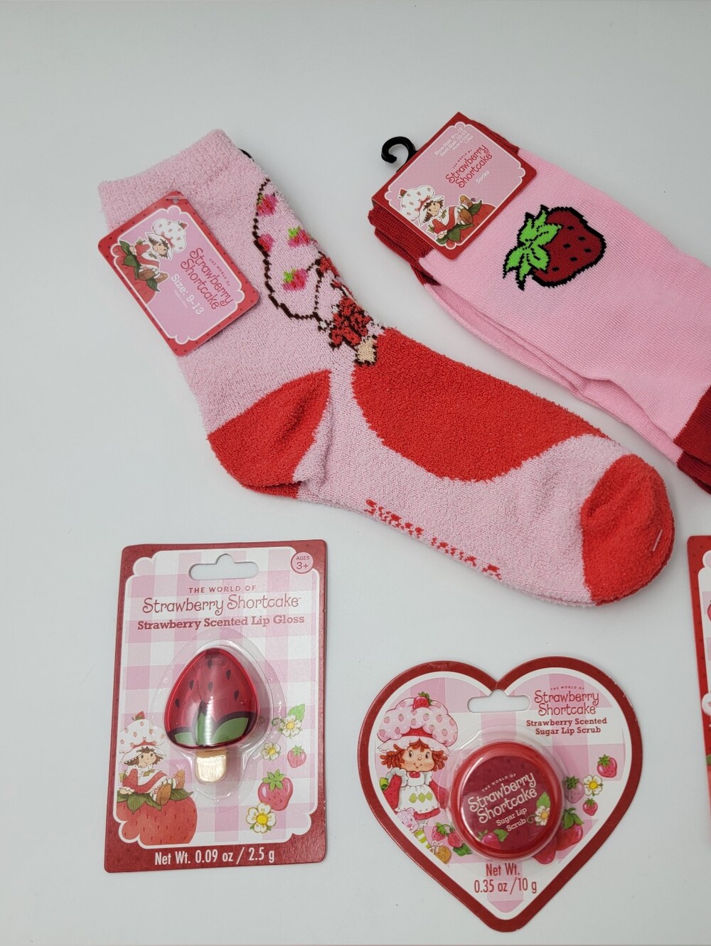 The World of Strawberry Shortcake Lip Balm Lip Gloss Lip Scrub Socks Bundle Set